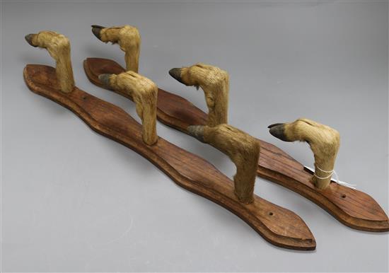 A deer hoof gun rack